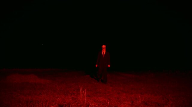 Creepy and Evil Boogeyman in Mask Approaching and Attacking, Scary Halloween and Horror Shot