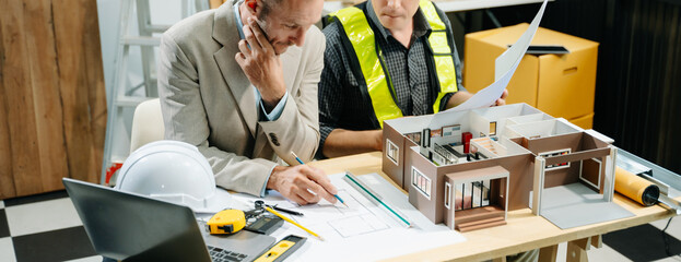 Architects and designers collaborating on models and plans, brainstorming innovative structures, and planning urban development in a modern office.