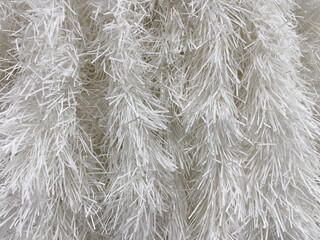Close-up of white tinsel texture. Abstract background for design.