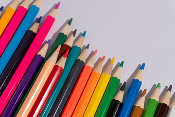 A row of pencils with one pencil standing out