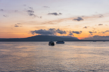 Series of sailing Ships enjoying a beautiful Sunrise in Banyuwangi, Indonesia.