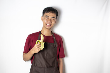 smiling teenage bartender with peeled banana in her hand