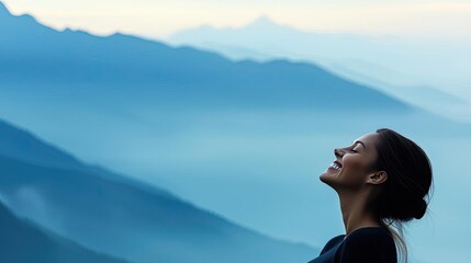 Naklejka premium Woman enjoying tranquility, standing against misty mountain backdrop.