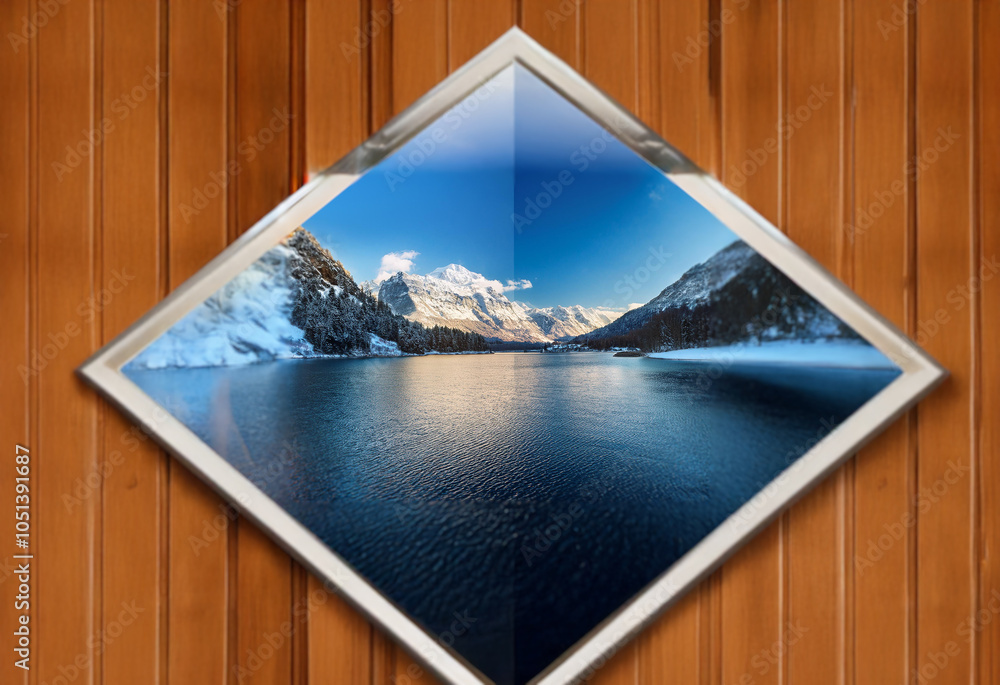Poster A diamond-shaped frame showcases a stunning landscape of a snow-capped mountain range reflected in a calm lake.