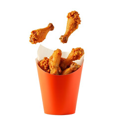 Delicious Fried Chicken Pieces Falling into a Red Takeout Cup for Fast Food or Restaurant Advertising