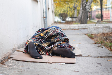 Homeless man sleeping. Poverty concept