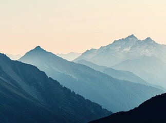 Fototapeta premium Silhouette of a person standing on a mountain top with scenic view of the mountains.