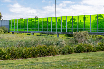 A functional and visually appealing noise wall stands tall, providing an aesthetic solution to...