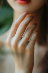 Close up of an elegant engagement diamond ring on woman finger