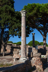 Columns remaining from ancient structures. Archaeological sites in Italy.
