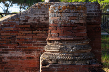Columns remaining from ancient structures. Archaeological sites in Italy.