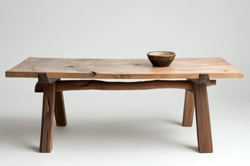 Fototapeta premium A wooden table with a bowl on top of it