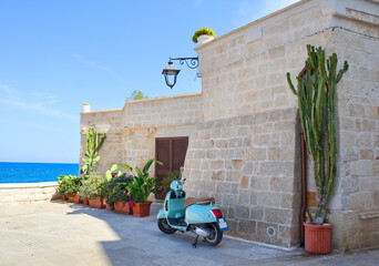Scooter near vintage house in downtown in Monopoli, Apulia, Italy
