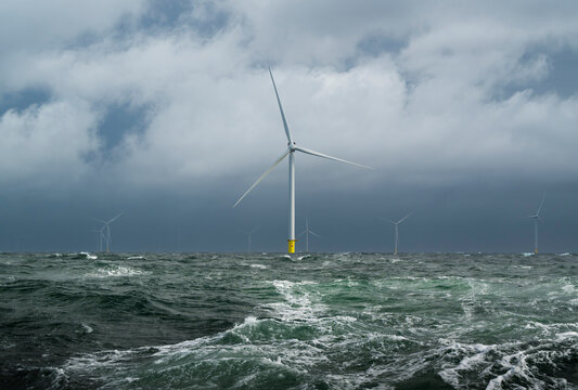 Windfarm in dutch part of North Sea with strong winds