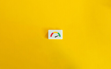 Speedometer Icon on Block Letter Tile on Yellow Background. Concept of Customer Satisfaction, Net Promoter Score (NPS).
