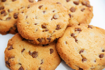 Chocolate chip cookies in close-up on a white background