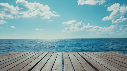 Fototapeta premium A scenic view of the ocean from a wooden dock, perfect for use in travel or beach-themed designs