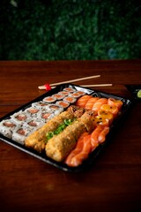 Delicious sushi assortment on a wooden table.