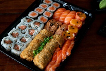 Assorted sushi rolls and nigiri with salmon.