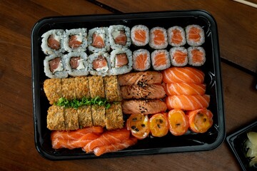 Assorted sushi platter with rolls and sashimi.