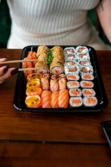 Sushi platter with assorted rolls and sashimi.