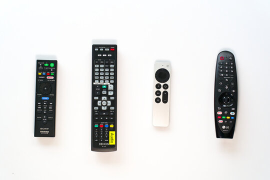Group of remote control devices of multimedia tv and audio equipment against white background. Photo taken October 28th, 2024, Zurich, Switzerland.