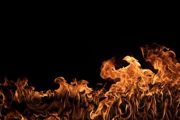 Bright orange flames rising on black background