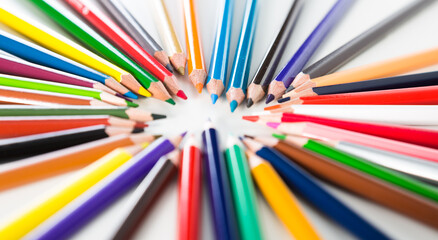 Colored pencils are arranged in a circle for study