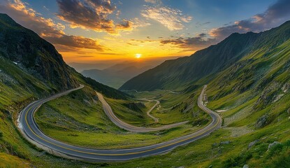 The winding road leads into the distance, with green mountains and grass 