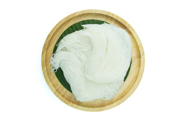 A wooden plate of Thai fermented rice flour noodles or rice vernicelli, Khanom Jeen in Thai, on green banana leaf isolated on white background top view flat lay with clipping path stcking