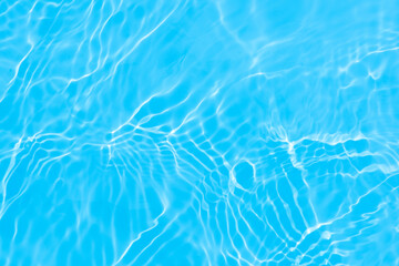 Blue water with ripples on the surface. Defocus blurred transparent blue colored clear calm water...