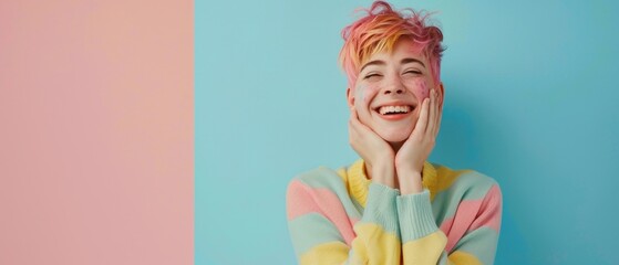 A smiling woman with multicolored hair in a striped sweater poses happily in a portrait, highlighting a joyous and playful vibe with a blue and pink background.