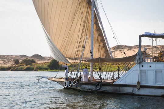 Dahabeah under sail, passenger river boat of the Lazuli fleet, sailing on the Nile river near Aswan, Egypt, North Africa, Africa