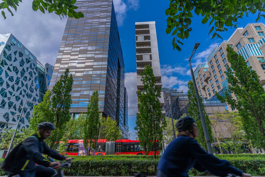 View of cyclists and contemporary architecture in the Barcode area on a sunny day, Oslo, Norway, Scandinavia, Europe
