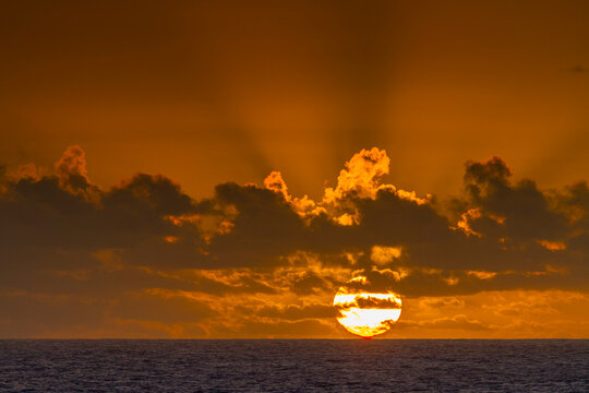 Sunset at sea near Nightingale Island, part of the Tristan da Cunha Group, South Atlantic Ocean