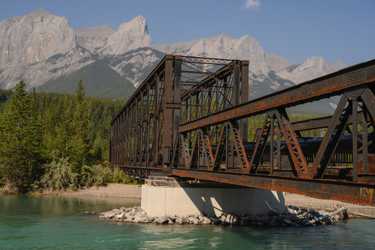 Bow River Iron Bridge and Mount Lawrence Grassi on a hazy summer evening caused by wildlife smoke, Canmore, Alberta, Canadian Rockies, Canada, North America
