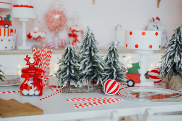 Festive holiday table setting with decor and treats in a cozy kitchen