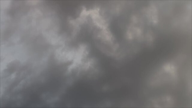 Strange clouds pinkish-hued sky at dus