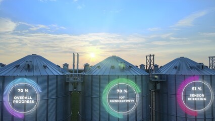 Digital Farm Data On Agricultural Grain Silos. Smart Farming Technology. Aerial drone shoot © TechAnimationStock