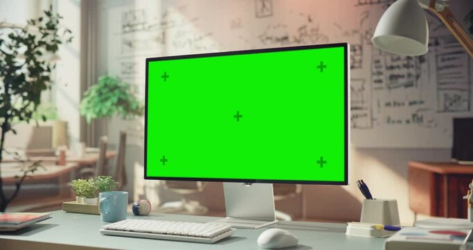 Green Screen Desktop Monitor in Stylish Home Office. Versatile Chroma key Setup for Content Creation, Video Editing. Stylish Minimalist Designer, Engineer, Programmer Studio with No People
