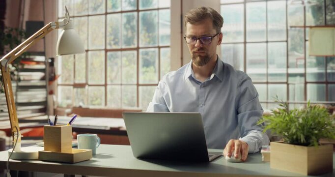 Professional Male Engages in Focused Work on Laptop at Home. Contemplative Gestures Reflect Deep Thought Process. Digital Gateway to Innovation, Where Ideas Transform Into Impactful Solutions.