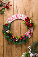 Christmas wreath on wooden background, banner, copyspace