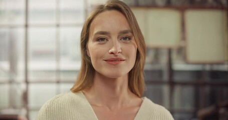 Woman in Cream Sweater Turns, Faces Camera. Contemplative to Confident Transition. Embodiment of Professionalism, Calm Expression of Success. Perfect Woman Looking at Camera