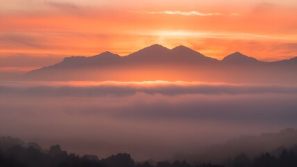 Obraz premium landscape sunrise fog mountain mist ethereal serene atmosphere golden hour nature