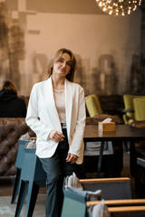 Elegant Young Woman in Chic Cafe Setting