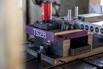 Sheet Metal Stamping Tool Die for Automotive Precision Parts on The Numerical Control Milling Machine Table. Tandem Stamping System. At a High Quality Technology Factory.