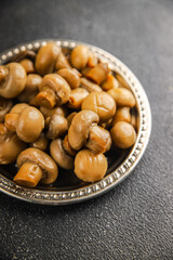 Champignon mushroom canned product tasty food dish fresh delicious gourmet food background on the table 
