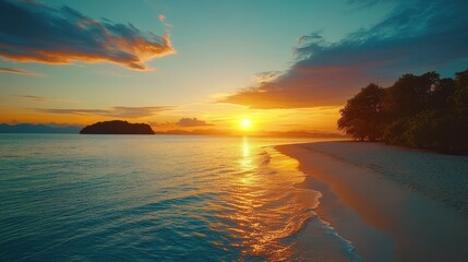 Obraz premium A serene sunset over a remote island, as the sun casts golden light onto a secluded beach.