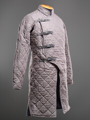 Historical fashion. Medieval knight cloth. Padded jacket gambeson.