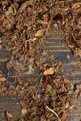 a broken and colored cigar made of high-quality tobacco leaves